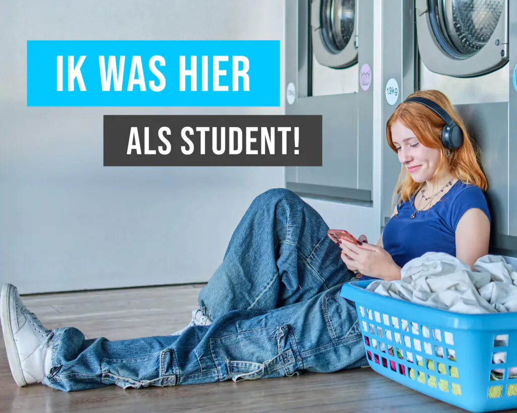Roodharige studente zit op de vloer van een wasserette terwijl ze wacht op haar was. Goedkoop wassen voor studenten zonder gedoe.